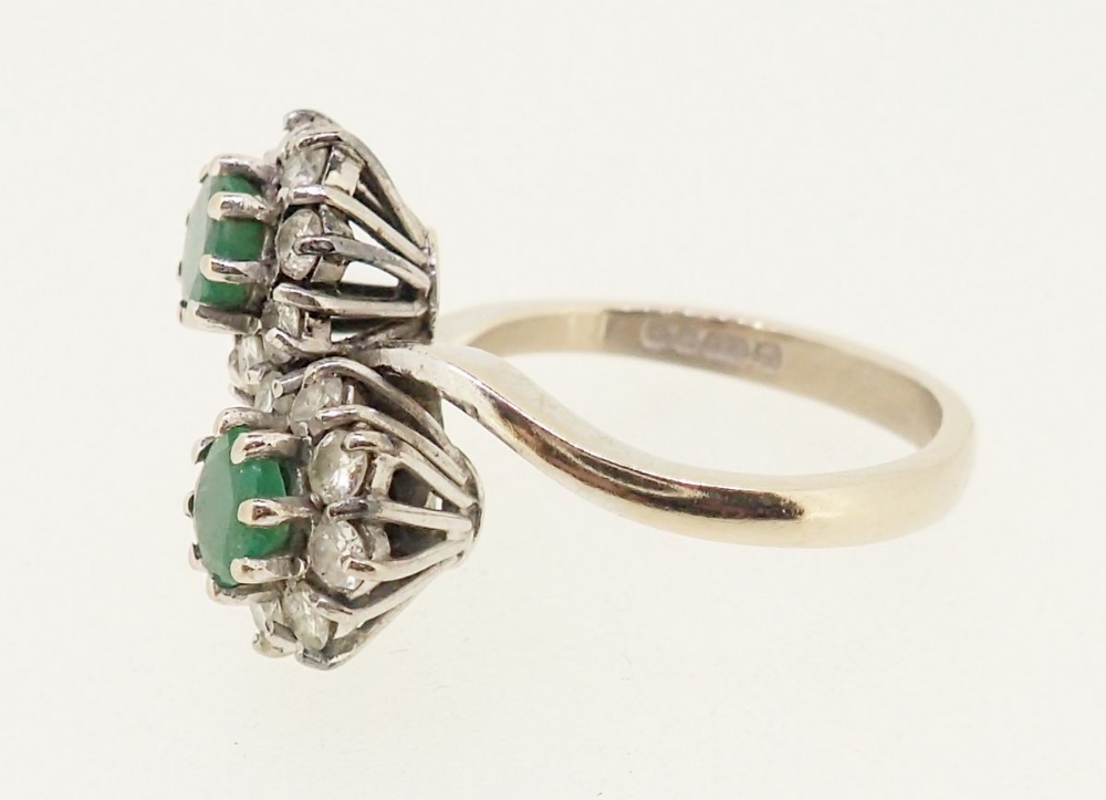 An 18 carat gold emerald and diamond cluster crossover ring, size O - Image 3 of 5
