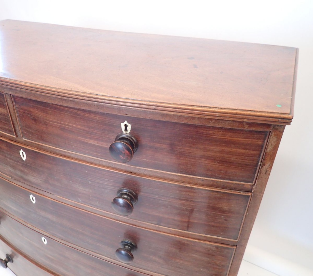 An early 19th century bow fronted mahogany chest of two short and four long drawers with bone - Image 2 of 4