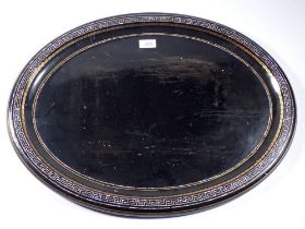 A Victorian oval papier Mache tray with mother of pearl Greek key border design, 63 x 49cm