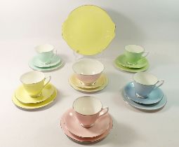 A Royal Albert Harlequin tea service, five cups and six saucers, six tea plates, sugar and cake