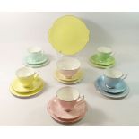A Royal Albert Harlequin tea service, five cups and six saucers, six tea plates, sugar and cake