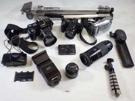 A box of cameras and camera accessories including Nikon, Minolta, camera stand etc.