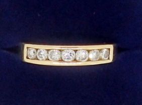 A 9 carat gold seven stone diamond ring, 2.5g, size M
