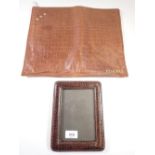 A crocodile skin pyjama case and a photo frame