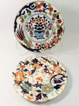 A Victorian plate painted flowers in Imari palette and an Ironstone plate painted in chinoiserie