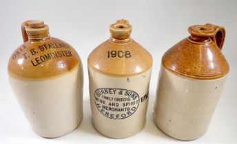 Three stoneware flagons - two printed T B Stallard, Leominster and Gurney & Sons, Hereford