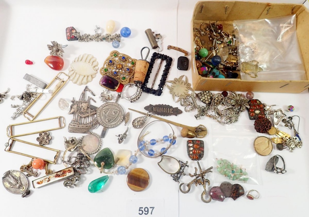 A box of antique jewellery fittings, buckles etc.