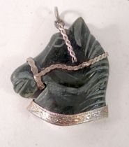 A jade horse head with silver mounts, 4 x 4cm