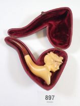 A meerschaum pipe in the form of a ladies head, cased, stem a/f