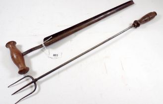 An antique cheese tester, 52cm and an iron toasting fork