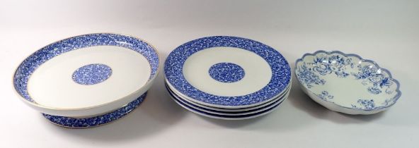 A Victorian Royal Worcester blue and white cake stand and four plates with floral reserve and