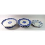 A Victorian Royal Worcester blue and white cake stand and four plates with floral reserve and