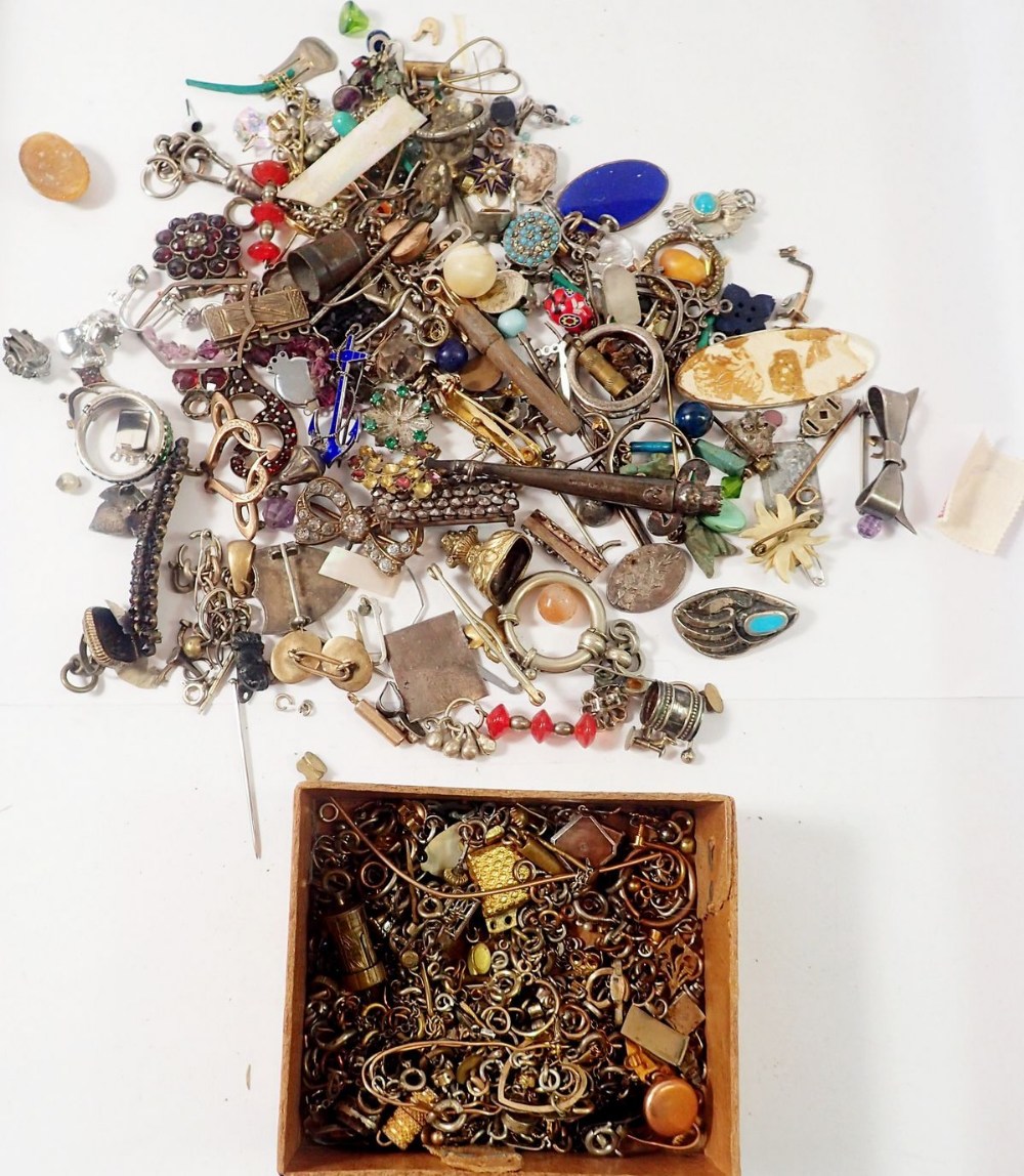 A box of white metal and yellow metal jewellery fittings and broken jewellery