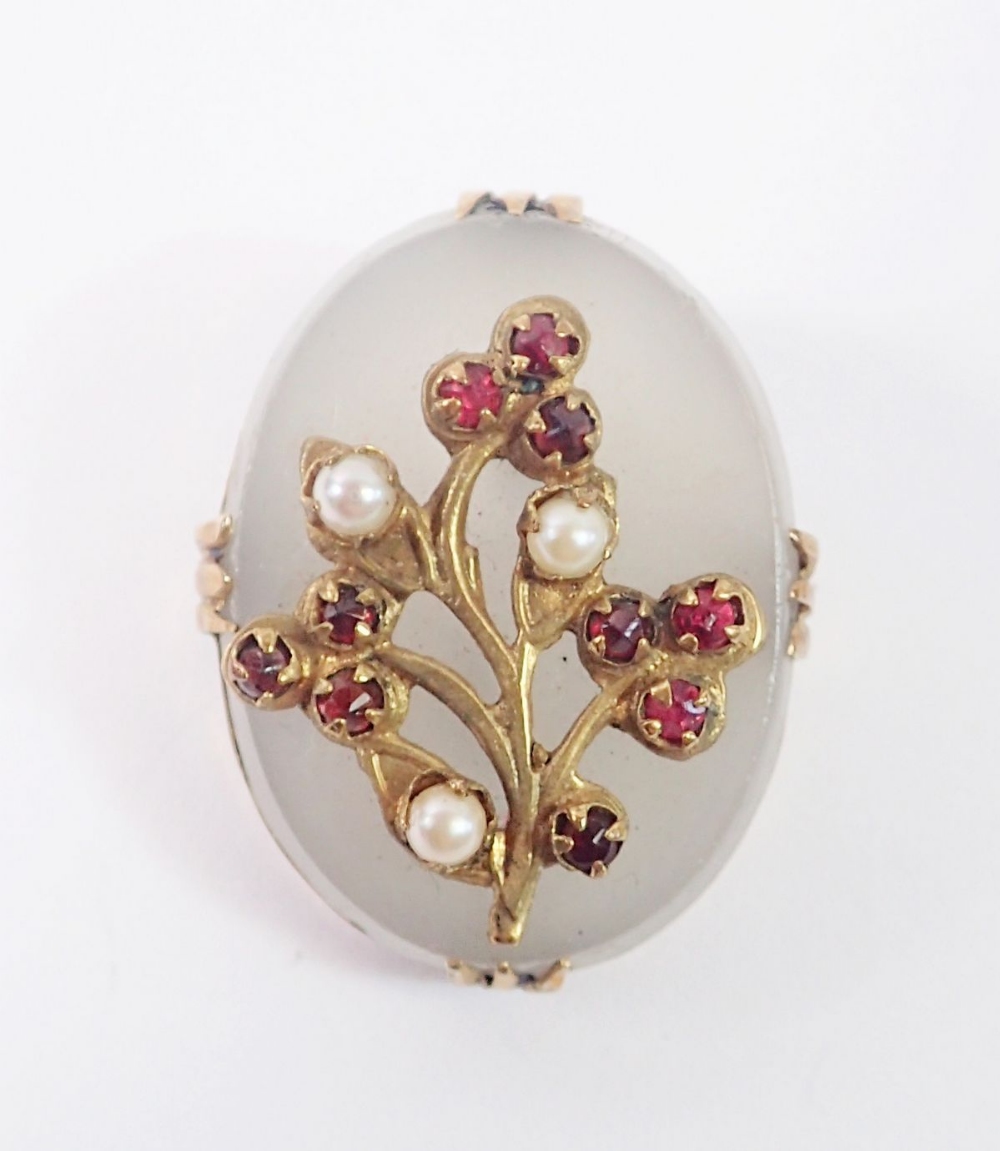 A gold mounted white onyx brooch set floral spray of garnets and seed pearls, 2.7 x 2cm