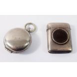 A silver vesta case inset Victorian coin, Chester 1885 and a silver plated sovereign holder