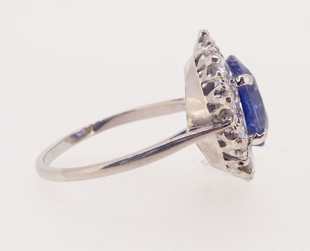 A fine Ceylon sapphire and diamond cluster ring, the sapphire 11mm x 8mm, ring size O, 4.8g - Image 5 of 7