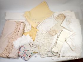 A box of table linen and lace