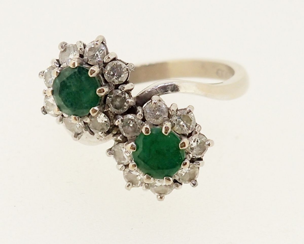 An 18 carat gold emerald and diamond cluster crossover ring, size O - Image 2 of 5