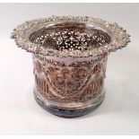 A 19th century silver plated bottle coaster with pierced decoration