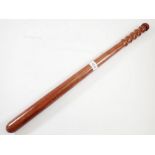 A long wooden truncheon, 65cm long