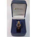 A Citizen ladies gold plated quartz watch, boxed