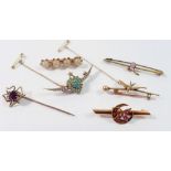 A selection of gold bar brooches and spider stick pin