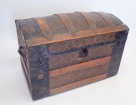 A Victorian floral embossed leather covered wood and metal bound dome top trunk, 81 x 45 x 53cm