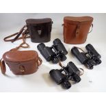 A pair of Octra 10 x 30 binoculars, an Ifoco pair 16 x 50 and a Wray 9 x 40 pair