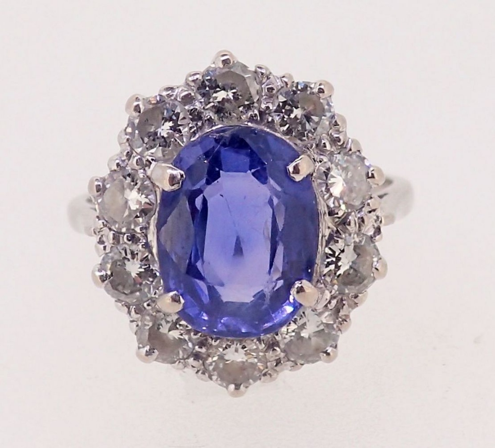 A fine Ceylon sapphire and diamond cluster ring, the sapphire 11mm x 8mm, ring size O, 4.8g - Image 2 of 7