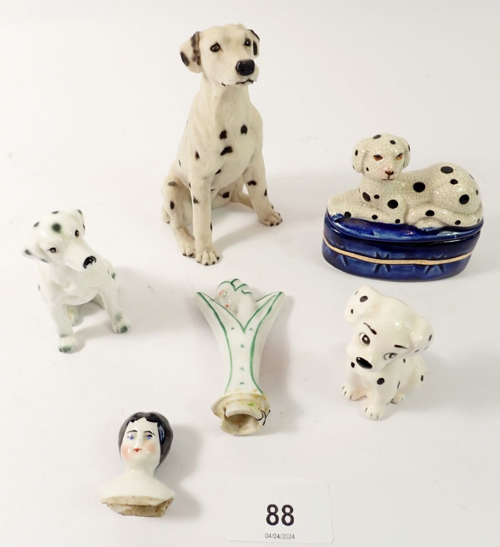 A group of dalmatian ornaments, an Art Deco pin dolly and a Victorian porcelain dolls shoulder head,