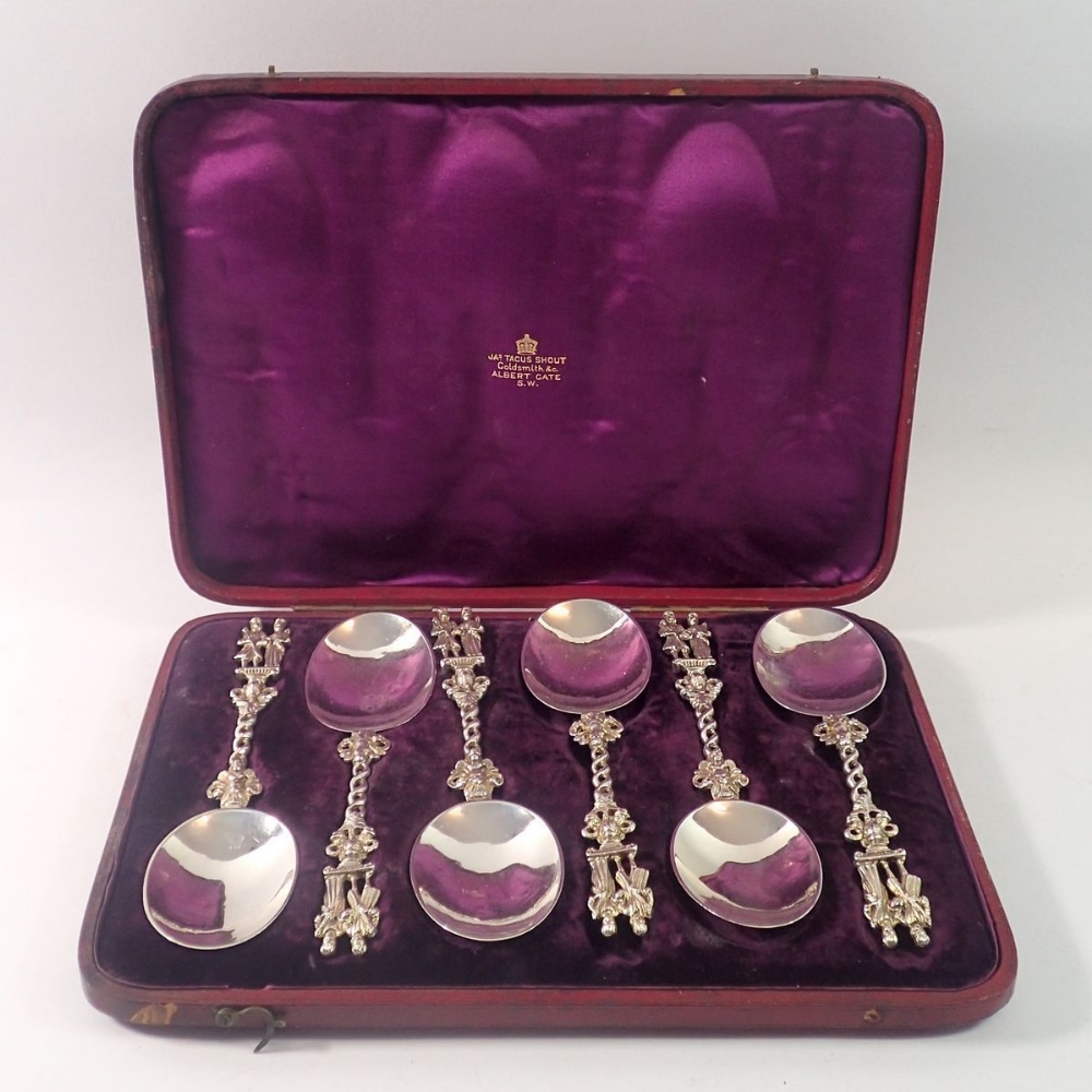 A Victorian set of six silver Dutch style serving spoons with king and queen terminals, cased,
