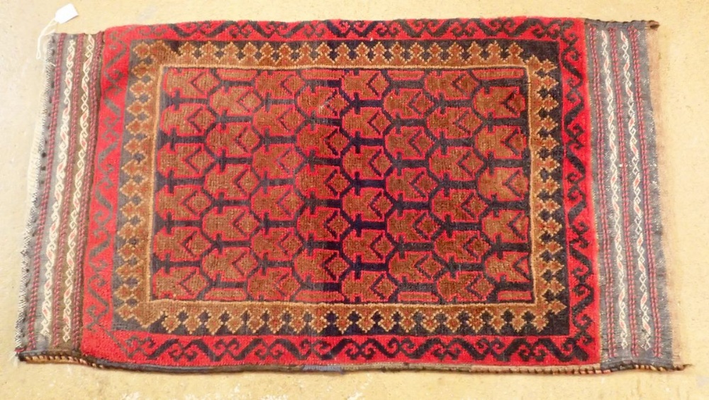 A Turkoman saddlebag with multiple guls on blue ground, 57 x 105cm