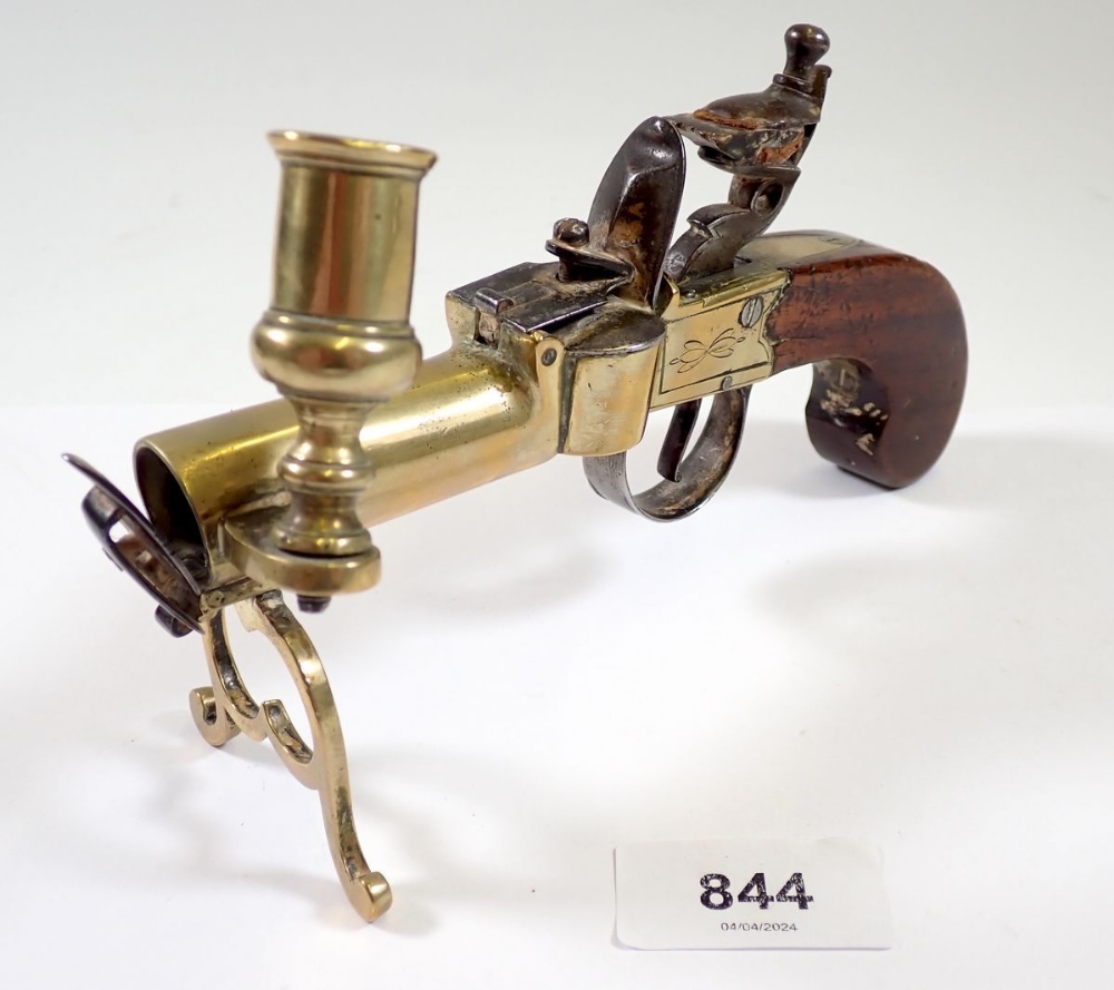 An antique percussion action pistol table lighter with taper stick, 17cm long and a brass stirrup - Image 2 of 3