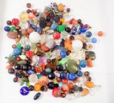 A quantity of glass and stone loose beads