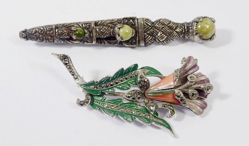 A Miracle stone set kilt pin and a large flower form enamel and marcasite brooch