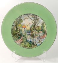 A porcelain plate painted landscape, signed John Flaxman to reverse, 24cm