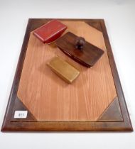 A leather bound and silk lined writing blotter pad and three blotters