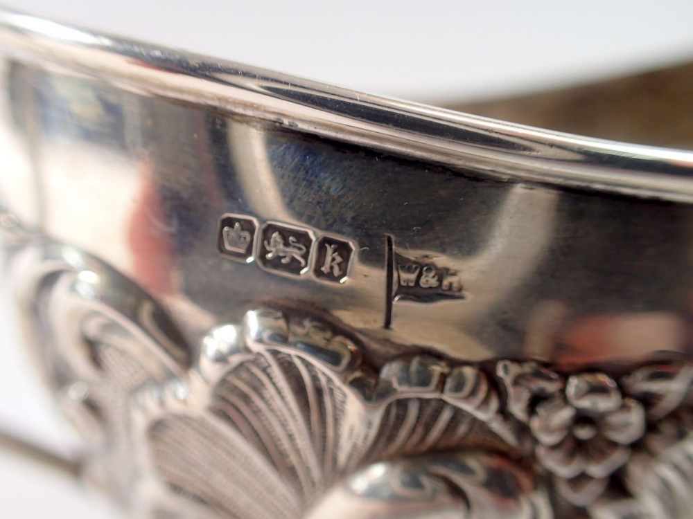 A Walker & Hall silver sugar bowl with embossed scrollwork decoration, Sheffield 1902, 8.5cm tall, - Image 2 of 2