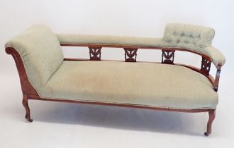 A Victorian mahogany chaise longue with carved and pierced urn decoration to back, 160cm long