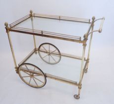 A vintage brass two tier drinks tea trolley with acorn finials, 90cm long x 79cm high