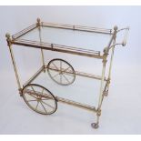 A vintage brass two tier drinks tea trolley with acorn finials, 90cm long x 79cm high