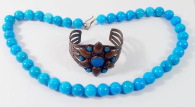 A North American Navajo turquoise and copper flower form bangle and a turquoise bead necklace