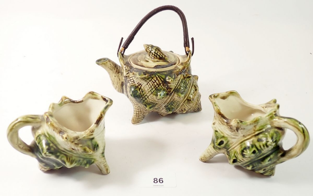 Two shell form jugs and a teapot, 9cm tall