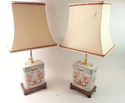 A pair of oriental porcelain rectangular table lamps 35cm tall and shades