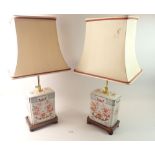 A pair of oriental porcelain rectangular table lamps 35cm tall and shades