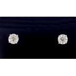 A pair of 14 carat white gold diamond stud earrings, approx. one carat each, for pierced ears with