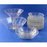 An early 19th century faceted cut glass dessert service with scalloped edges comprising comport,