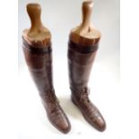 A pair of 1930's mens military brown leather field boots with wooden boot trees, approx size 10