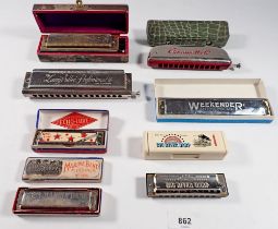 A collection of seven Hohner harmonica's - boxed