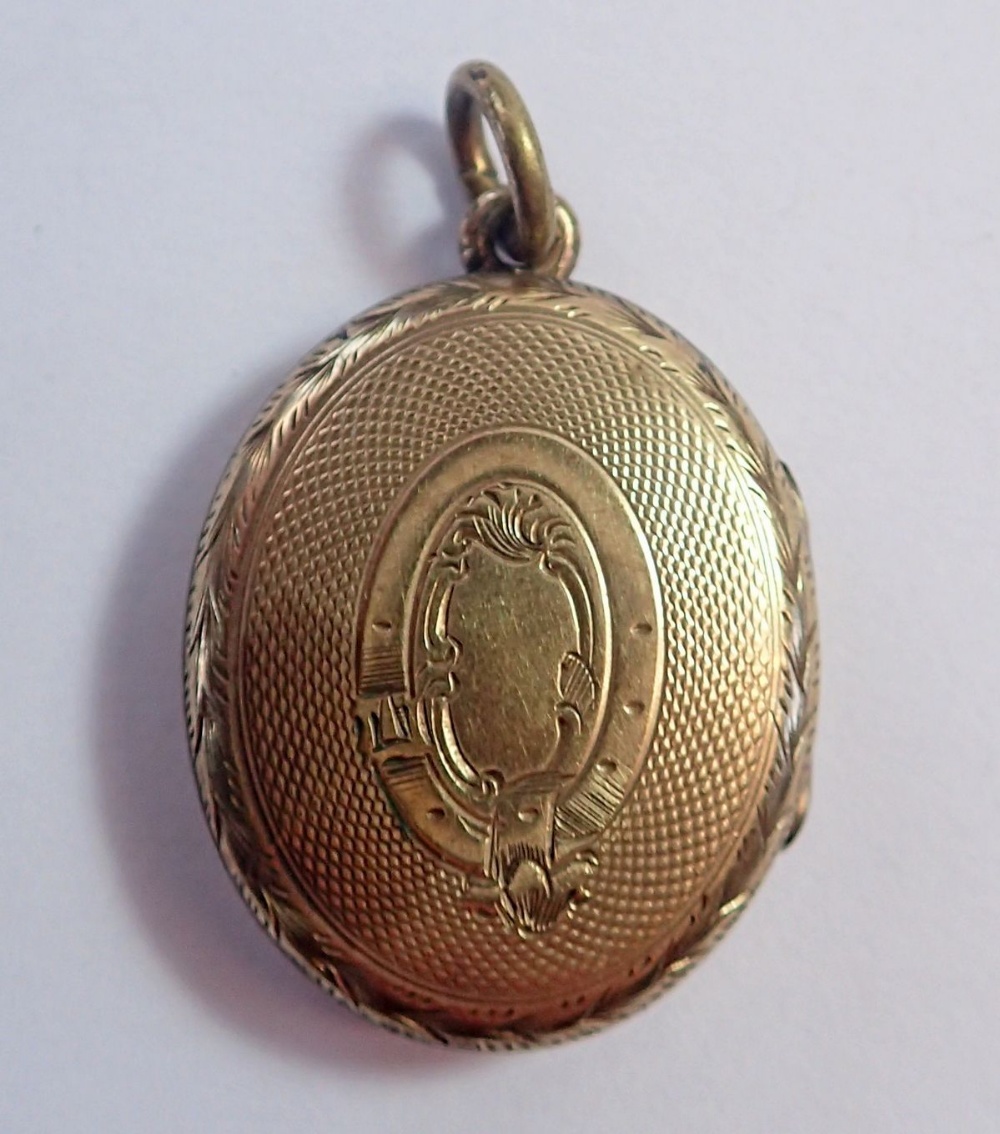 A Victorian gold oval locket with blue enamel vine inlay, unmarked but tested as 9ct gold 5.6g, 2. - Image 2 of 3